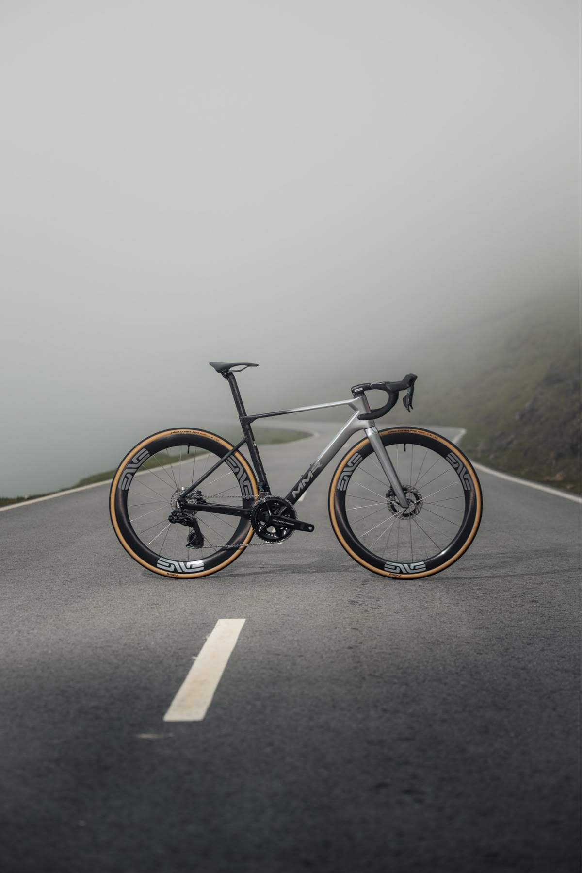 A road bike on a misty mountain pass